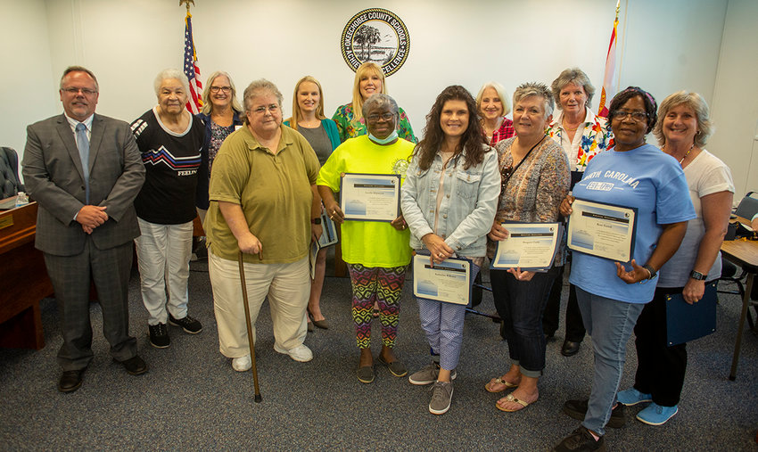 Volunteers of the Buddy program were recognized by the Okeechobee County School Board in 2022. [Photo by Richard Marion]