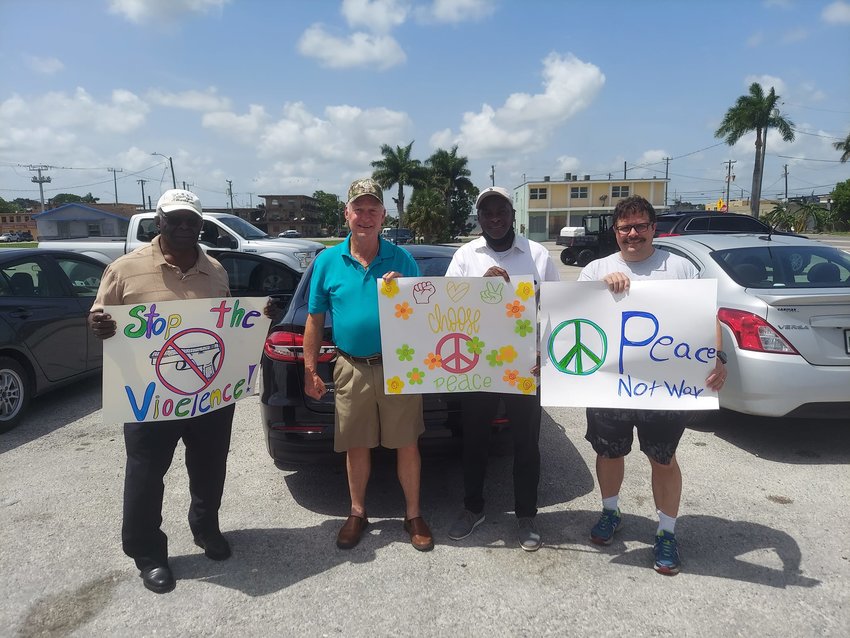 The Glades Ministerial Community coming together to address community violence. Thanks Belle Glade Boys and Girls Club teen center for making the signs for the peace walk.