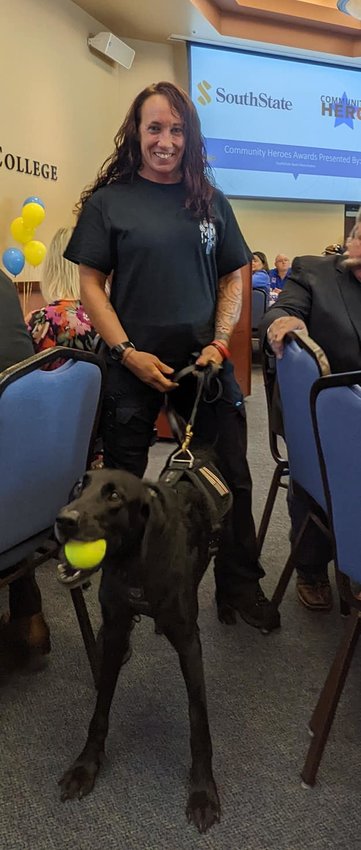 K9 Luna was very excited to receive her award. She is accompanied by her partner Sgt. Jessica Francis.
