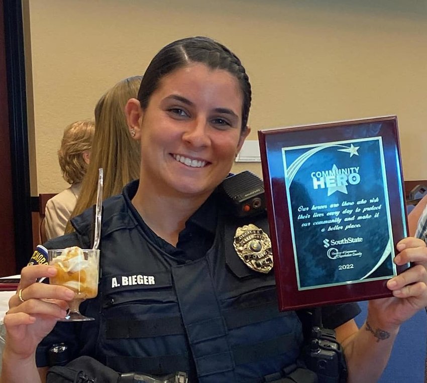 Officer Alexis Bieger is excited about the delicious desserts and the Award.