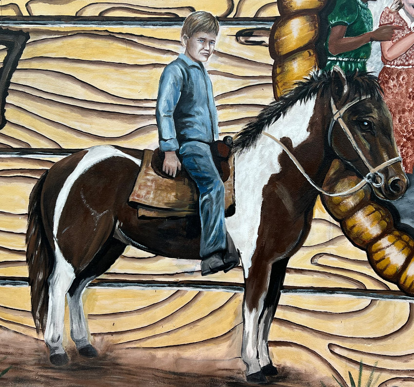 A very miserable 9-year-old Haynes Williams is depicted in the 1937 Cattle Drive Mural in Okeechobee. He later said he cried to go home the entire time.