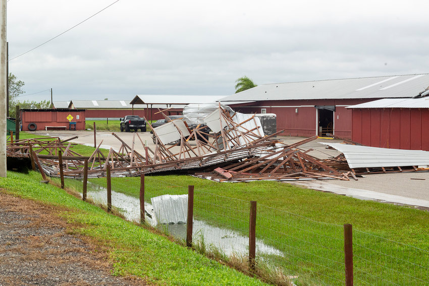 Sections of the roof were torn off the Trading Post Flea Market in Okeechobee. [Photo by Richard Marion]
