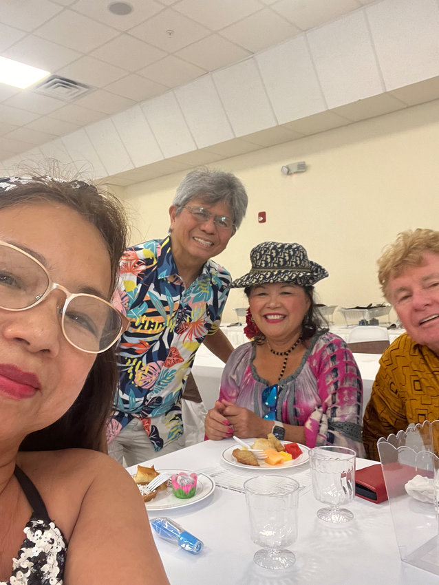 Dr Gerard Flores, president, ( in Hawaiian shirt) entertained guests during Wine Tasting and photography Exhibits on Sept 25,2022