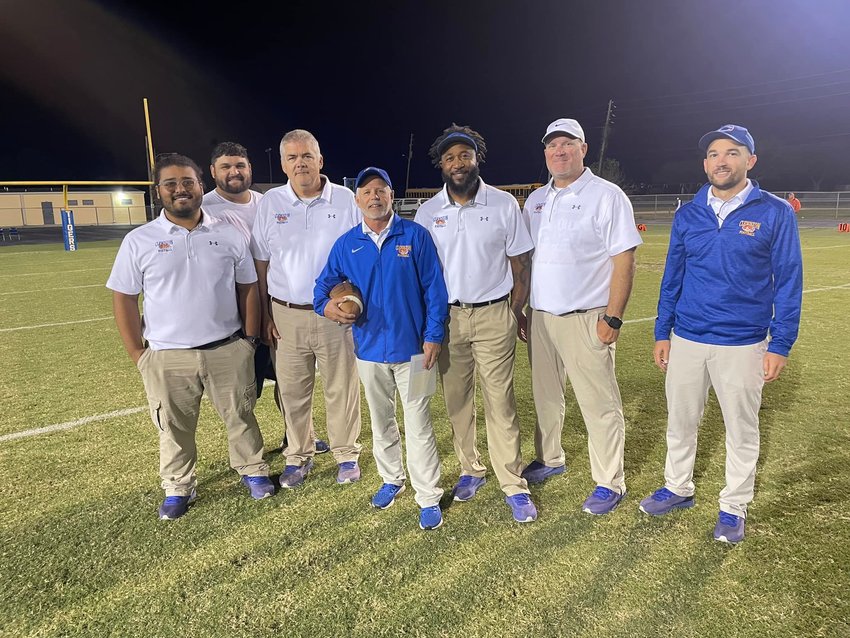 Coach Pete Walker with his coaching staff. [Photo courtesy Clewiston Athletics]