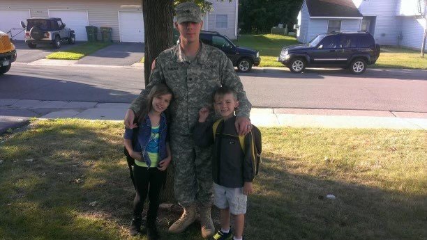 Veteran Josh Pancake sees his children off to their first day of school. Brenna (left) was entering first grade, and Aaron was entering kindergarten.