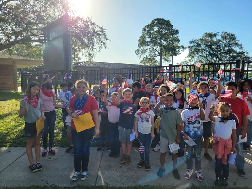 Everglades Elementary School students wore red, white and blue and waved flags during their ceremony.