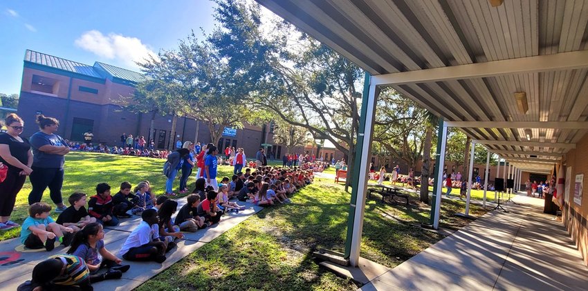 South Elementary School students enjoy hearing their school choir sing on Veterans' Day.