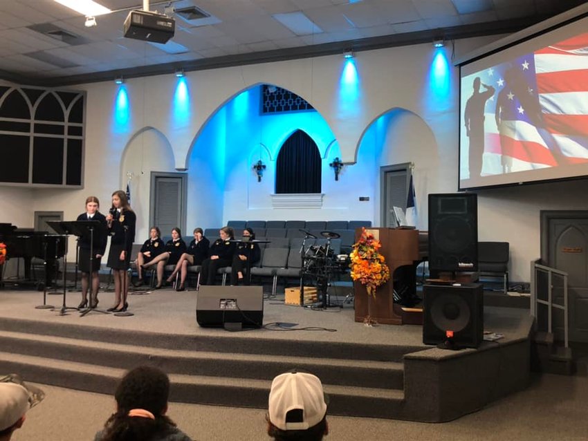 Not only did the public school students participate in their own school ceremonies, but some took time out of their days to visit private schools. Here, the Okeechobee High School FFA helped with a ceremony for Rock Solid Christian Academy.