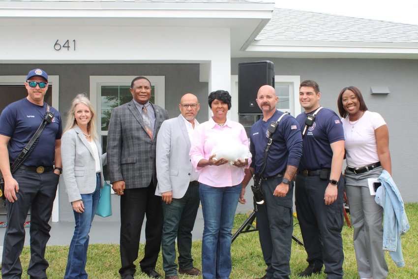 BELLE GLADE -- County and local officials were on hand to congratulate the Greens on their new home and wish them a Happy Thanksgiving. [Photo courtesy Habitat for Humanity]