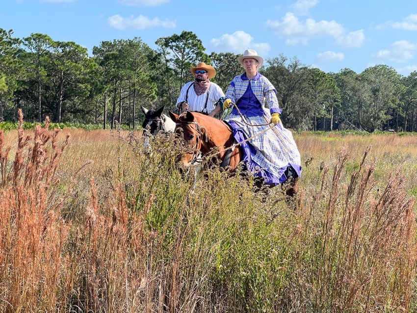The Great Florida Cattle Drive attracted participants from all over the United States. This couple and their horses traveled from South Carolina. [Photo by Katrina Elsken/Lake Okeechobee News]