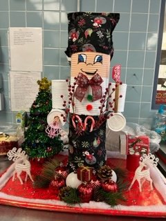 Everglades stayed true to the nutrition department and created this cutie patootie lunchroom cook, decked out in apron with pocket!