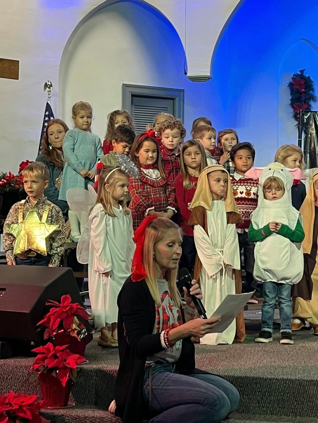 Led by teacher Lisa Baird, Rock Solid Christian Academy preschoolers perform in the annual Christmas program.