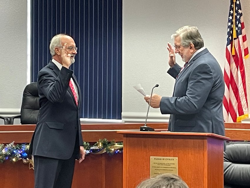 Judge/County Clerk Jerald Bryant (right) swore David McAuley in for his first term as city councilman. McAuley said he plans to take some time to learn the ropes and has no intention of making any big changes right away.