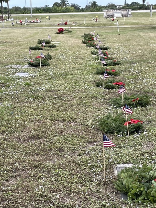 Wreaths and flags decorated graves of veterans at Ridgelawn Cemetery. [Courtesy photo]