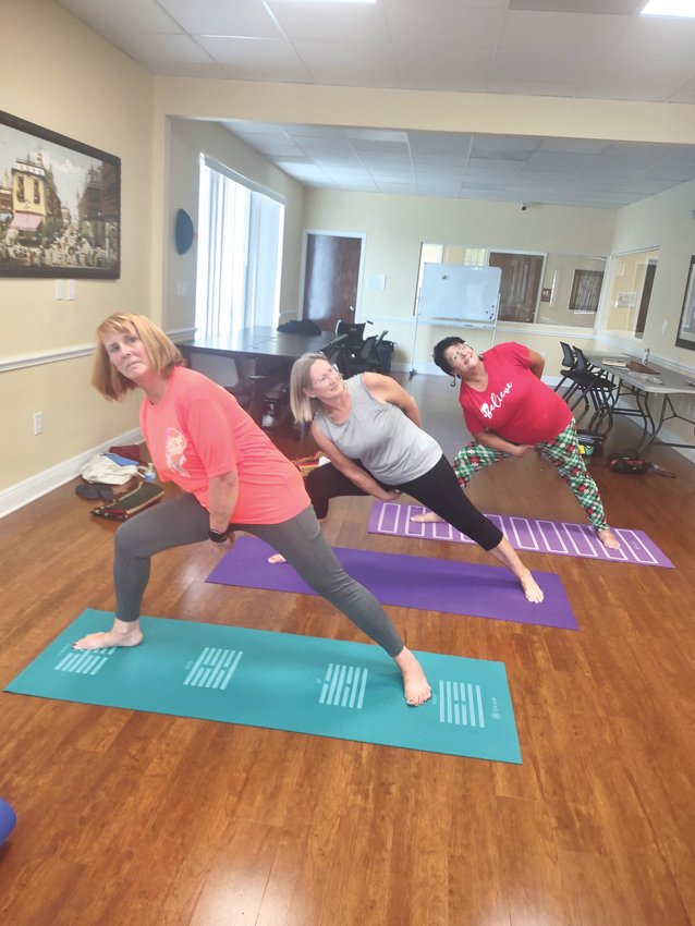 This week’s challenge is the “Wide Legged” lengthening pose as executed in the picture by Kathy Missel, Mary Lowe and Cynthia Buckwalter.