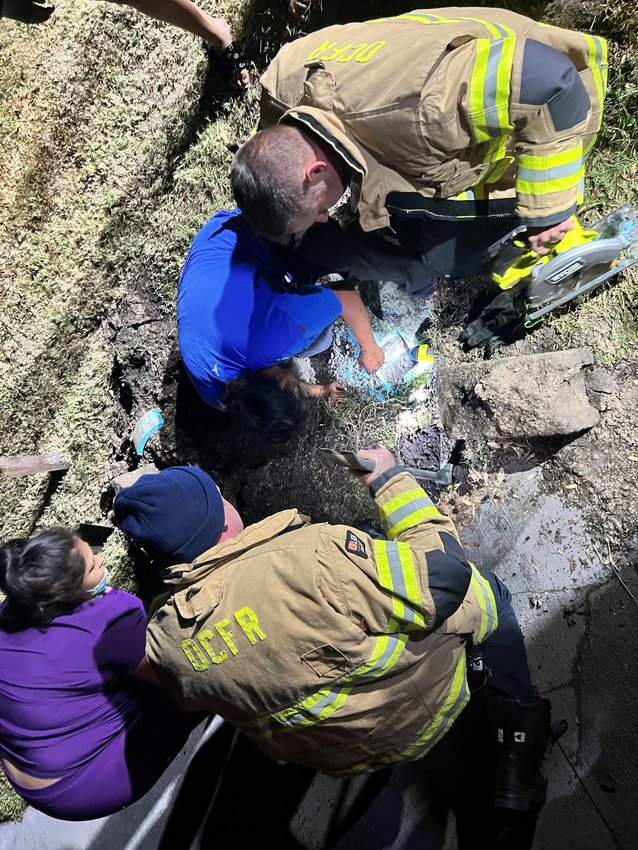 Around 7 PM on January 16, 2023, Okeechobee County Fire Rescue responded to a reported animal rescue. The arriving crew discovered that a dog was trapped by dirt and water about 50 feet into a 100 foot long culvert. Using shovels to dig down to the culvert and a Sawzall to cut into the culvert, the crew was able to rescue the dog and reunite it with its owner.