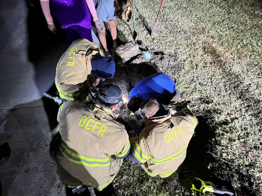 Around 7 PM on January 16, 2023, Okeechobee County Fire Rescue responded to a reported animal rescue. The arriving crew discovered that a dog was trapped by dirt and water about 50 feet into a 100 foot long culvert. Using shovels to dig down to the culvert and a Sawzall to cut into the culvert, the crew was able to rescue the dog and reunite it with its owner.