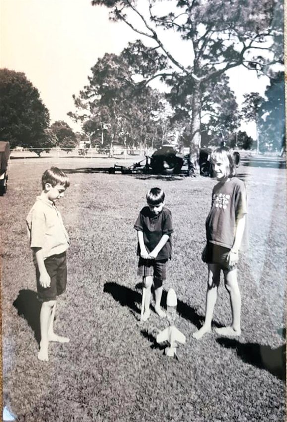 Nine-year-old John Renfranz (left) supervises his little brother Eli (middle) and older sister (Christy) for a model rocket launch in Okeechobee. [Courtesy photo]