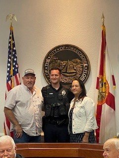 Officer Garret Kelley is pictured with his parents after his pinning on Tuesday night.