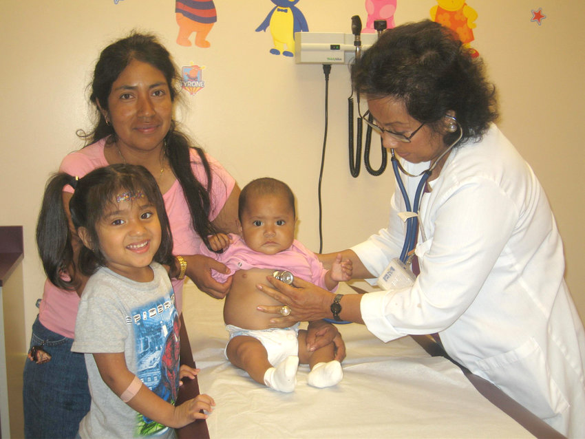 Dr. Sakornsin with patients. [Photo courtesy Healthcare Network]