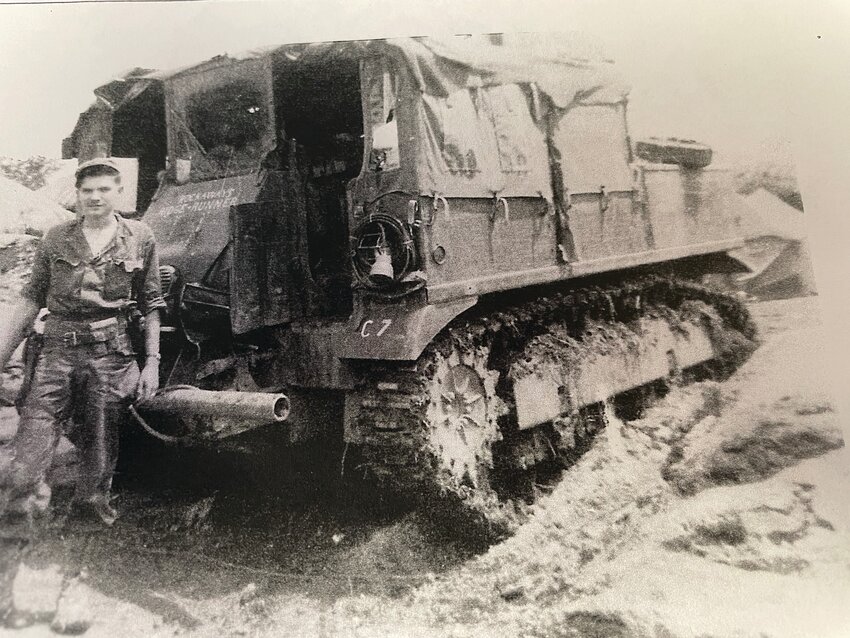 This is the M5 tractor that pulled the gun, 10 crew and the driver, Frank Cunningham. In this picture Cunningham is wearing two of the pistols his father sent him while he was away. "They called me 'Rock-a-way' because of my habit of swaying when standing and talking to you."