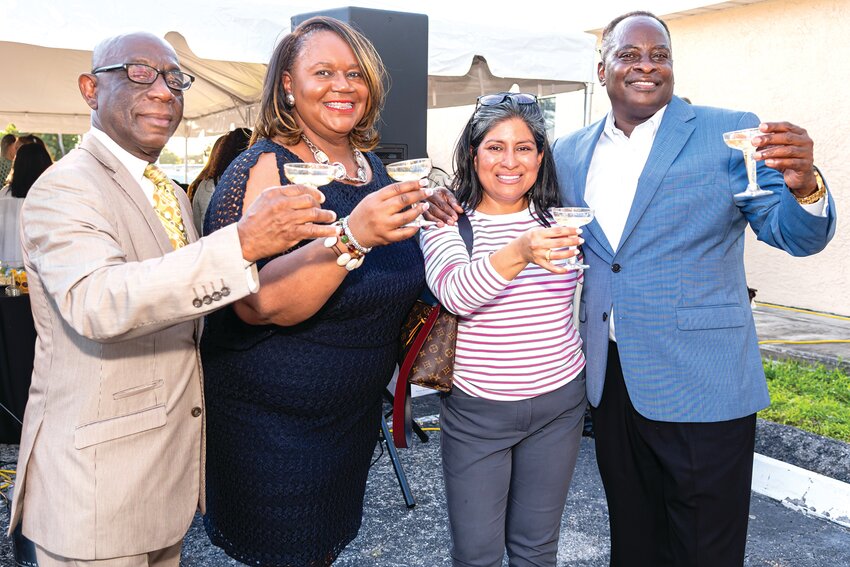 South Bay Mayor Joe Kyles, Dress for Success Executive Director Joe Ann Fletcher, Florida Crystals External Affairs Director Caroline Villanueva, and Belle Glade Mayor Steve Wilson joined in the toast to year two of the Belle Glades location of Dress for Success.