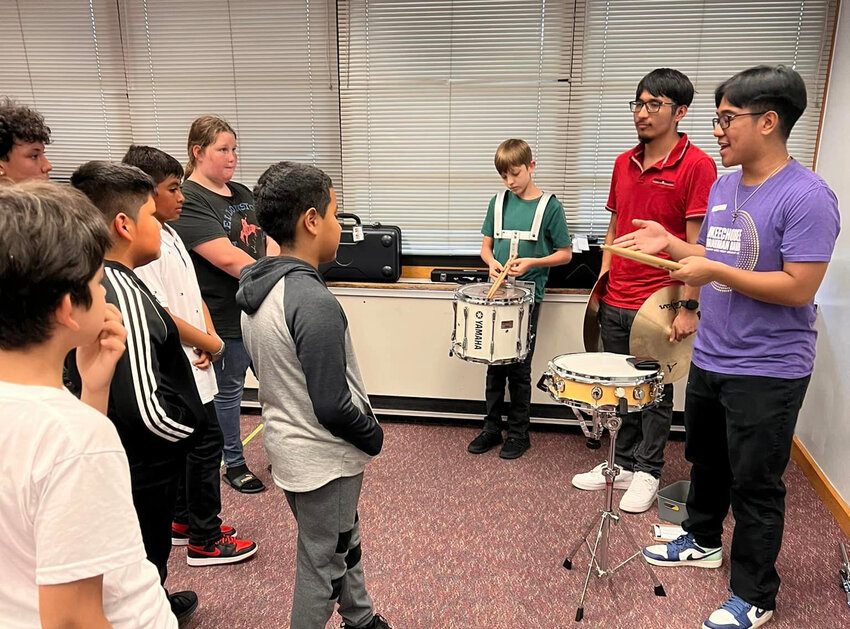 Students from Yearling Middle School show off their instruments to fifth graders at Seminole Elementary. [Photo courtesy YMS/Lake Okeechobee News]