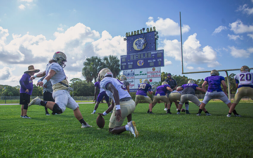 The Brahmans practicing extra-point kicks on Aug. 12.