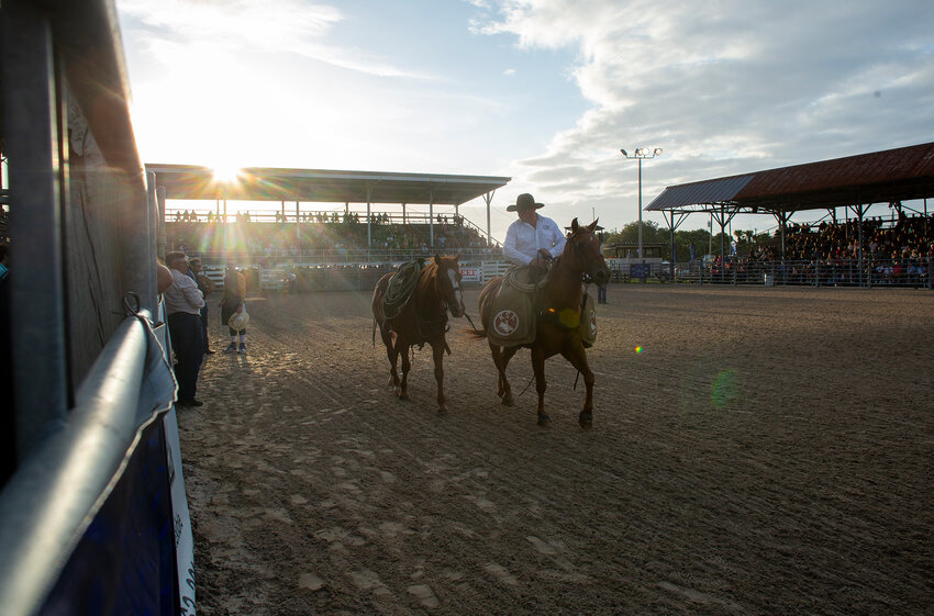 A horse with an empty saddle was led around the Okeechobee County Cattlemen's Assocation Arena to honor Gene Bernard Fulford.