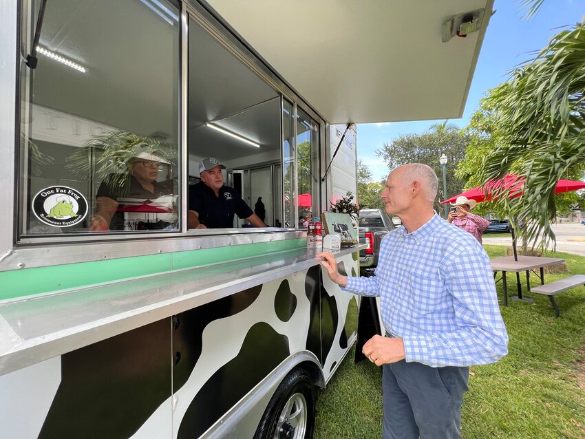 CLEWISTON -- Senator Rick Scott stopped by the Milking R Dairy trailer at the John Boy Auditorium on Sept. 8.