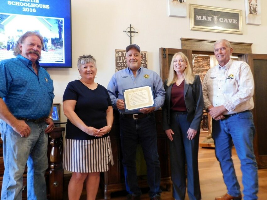 County Commissioners Brad Goodbread, Frank DeCarlo and David Hazellief, County Administrator Deborah Manzo along with Historical Society President Magi Cable.