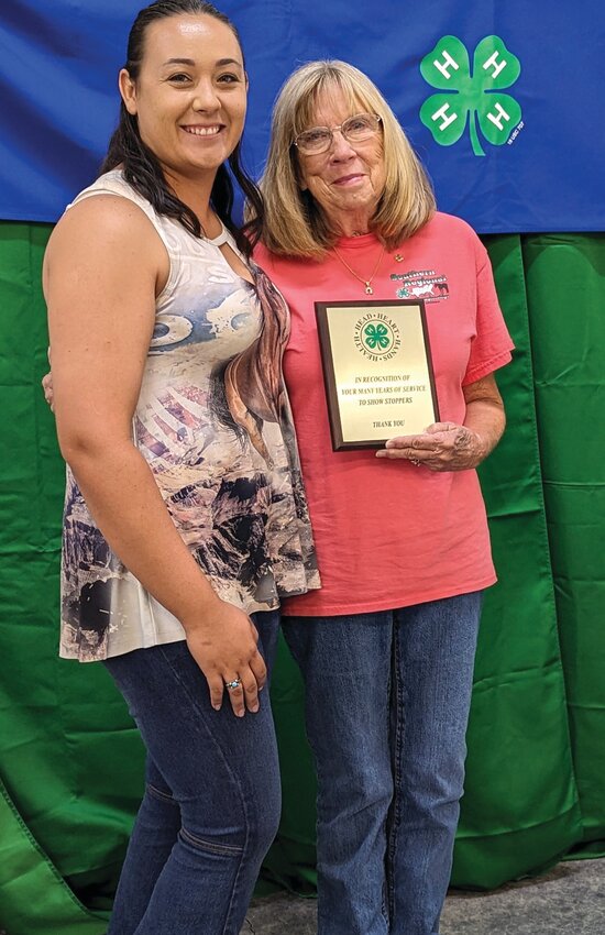 Sierra Coward presented Suzanna Rucks with a Service Award for her many years of dedication to the youth in horse programs in Okeechobee.