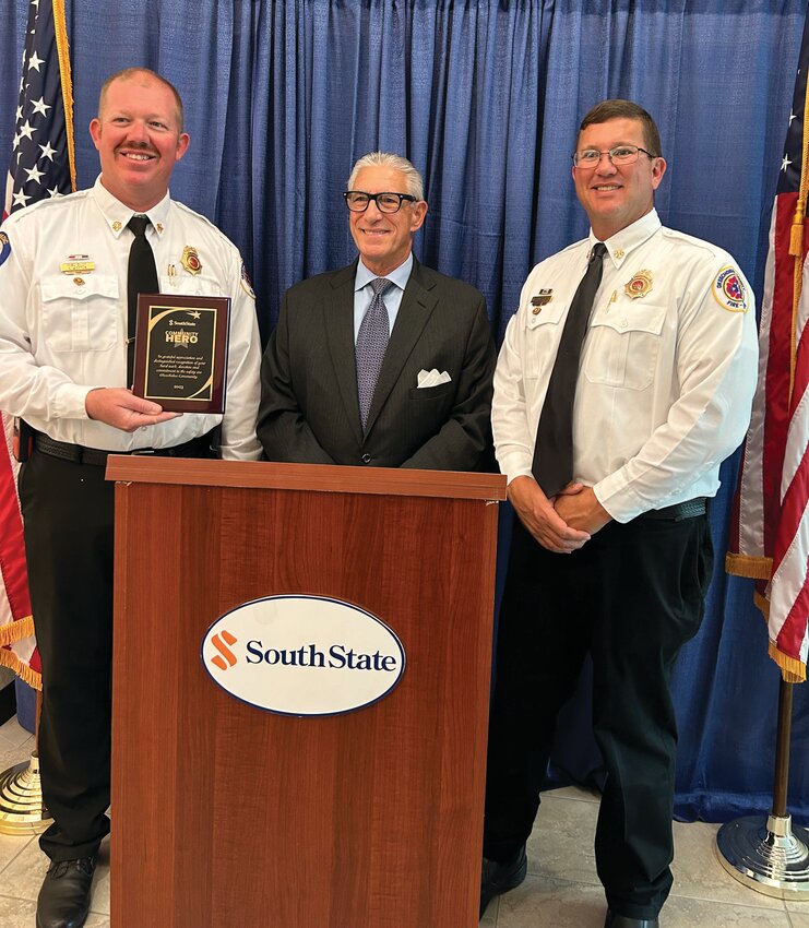 Okeechobee County Fire Rescue as a whole was chosen for a Hometown Hero award. Accepting on behalf of OCFR were Chief Earl Wooten and Deputy chief Justin Hazellief. Also pictured is the guest speaker of the event, retired Marine Corps Lt. General Frank Libutti.
