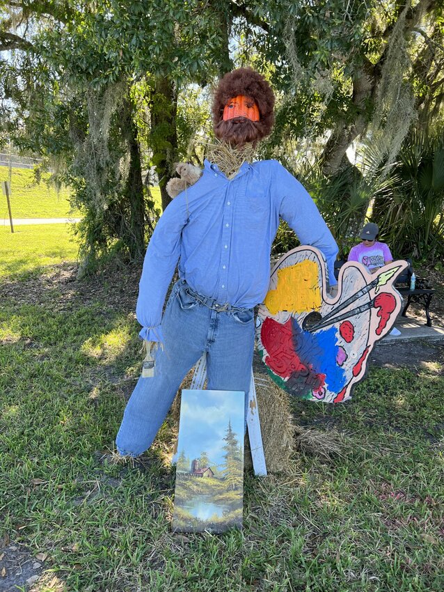 LABELLE -- Bob Ross, whose television show "The Joy of Painting" taught people to paint, is honored by this scarecrow. [Photo by Katrina Elsken/Caloosa Belle]