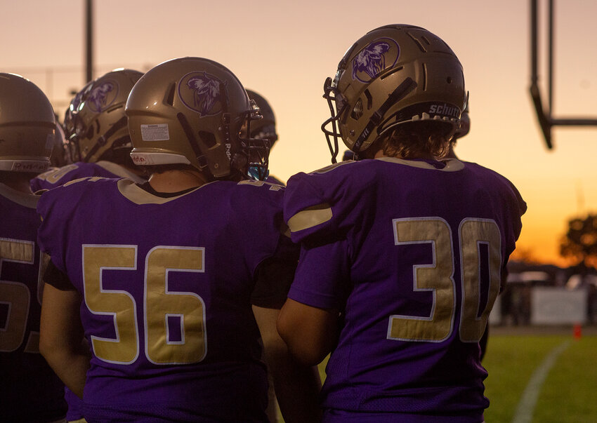 The Brahmans prepare to take the field against Lake Placid as the sun sets on Oct. 20.