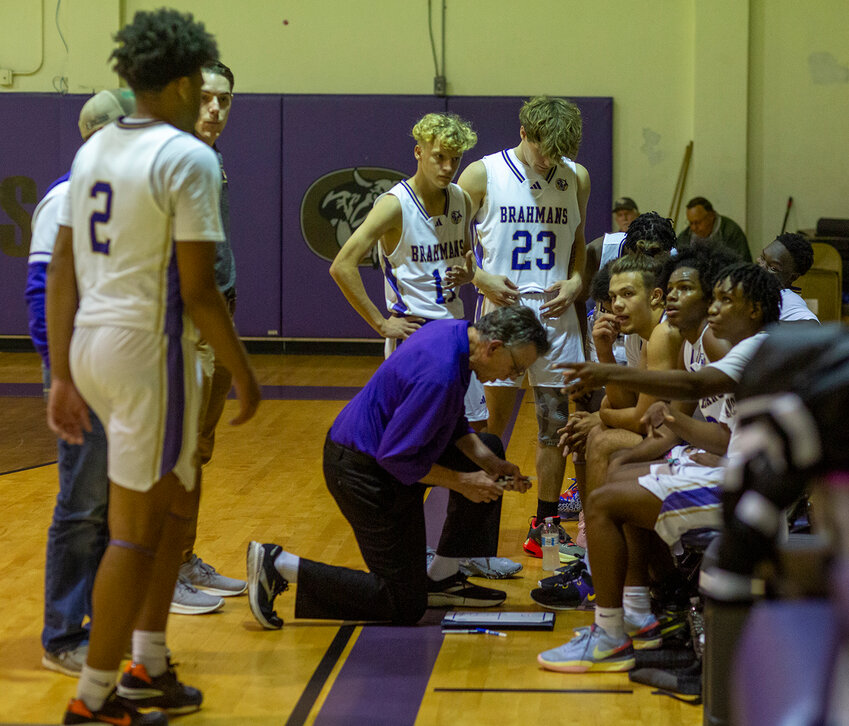Brahman coach Pat Kelly works on a play during a timeout.