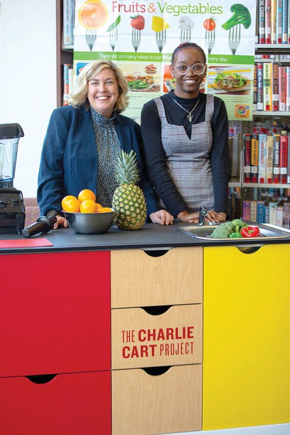 Kendra Auberry, Librarian and Assistant Professor at the Indian River State College Pruitt Campus Library (left) and IRSC student Jezyah Mann demonstrate the new Charlie Cart at the Pruitt Campus library. IRSC Libraries will utilize their new Charlie Cart Kitchen to offer free hands-on cooking classes to area residents and students. (Photo by James Crocco/IRSC)
