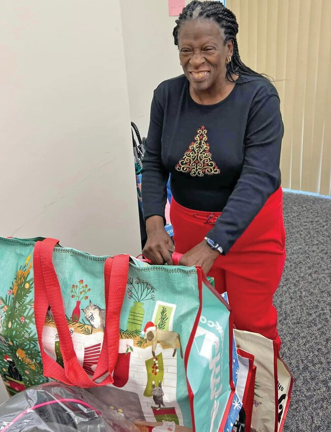 Portia George, CCKids Family Support Worker, helps case managers get toys to their families. (Photo courtesy CCKids)