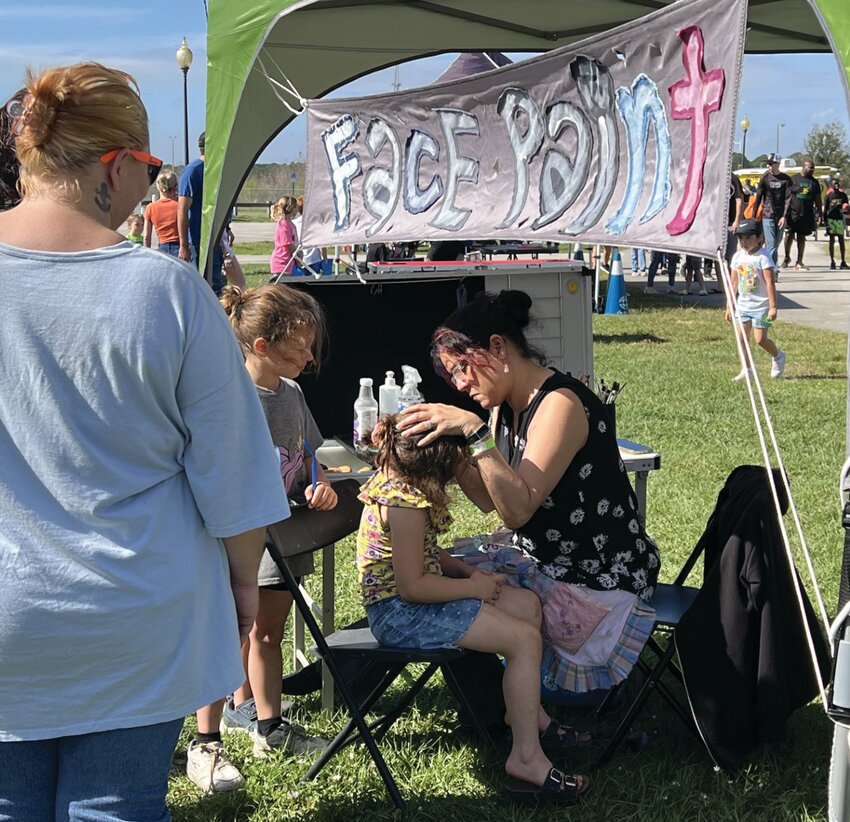 OKEECHOBEE -- Children lined up for free face painting at the Okeechobee Health & Safety Expo.
