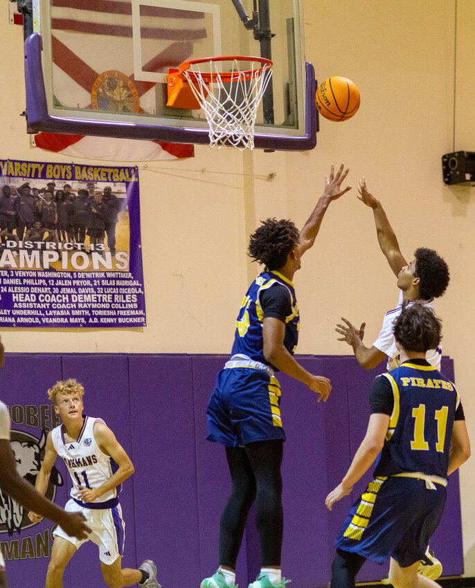 Oliver Saunders attempts a layup against Tradition Prep. [Photo by Richard Marion]