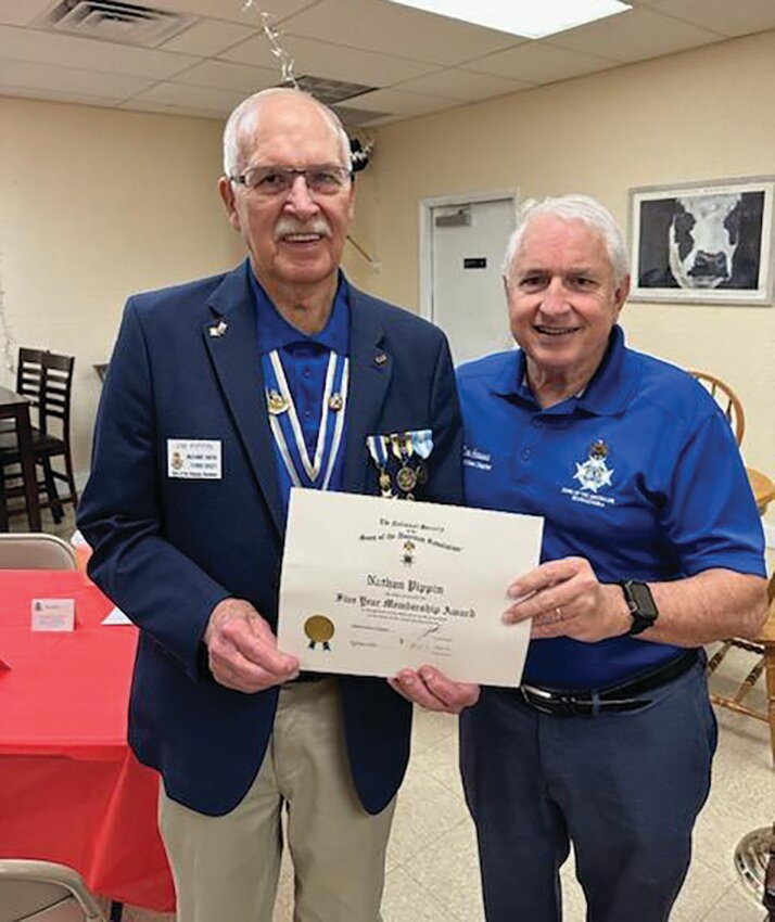 SAR president Don Hanna presented Nathan Pippin’s five year membership certificate to his father Jim.