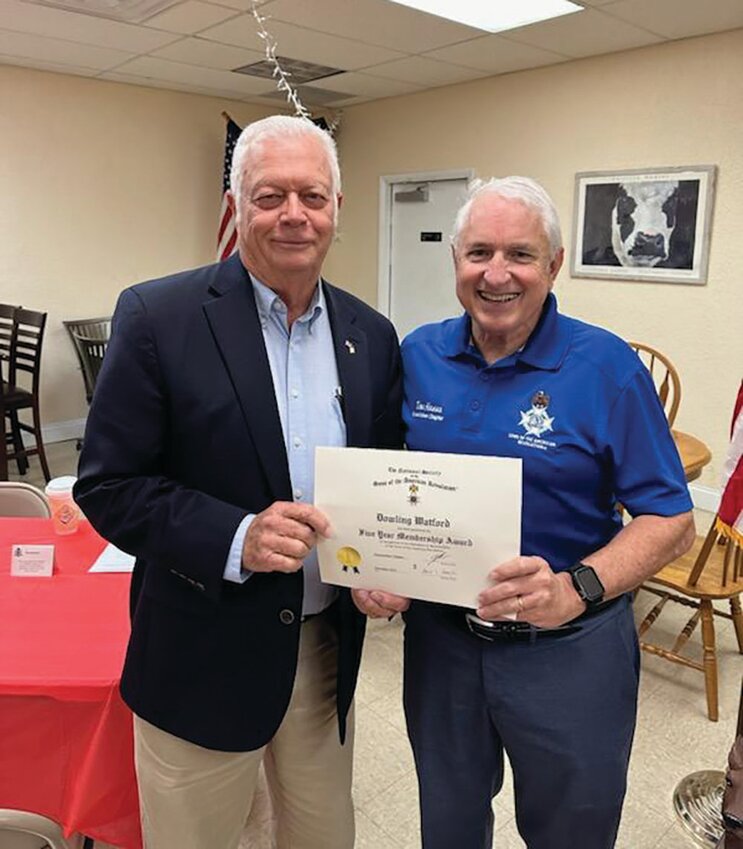 SAR president Don Hanna presented a five year membership certificate to Dowling Watford. [Photo courtesy Sons of the American Revolution]