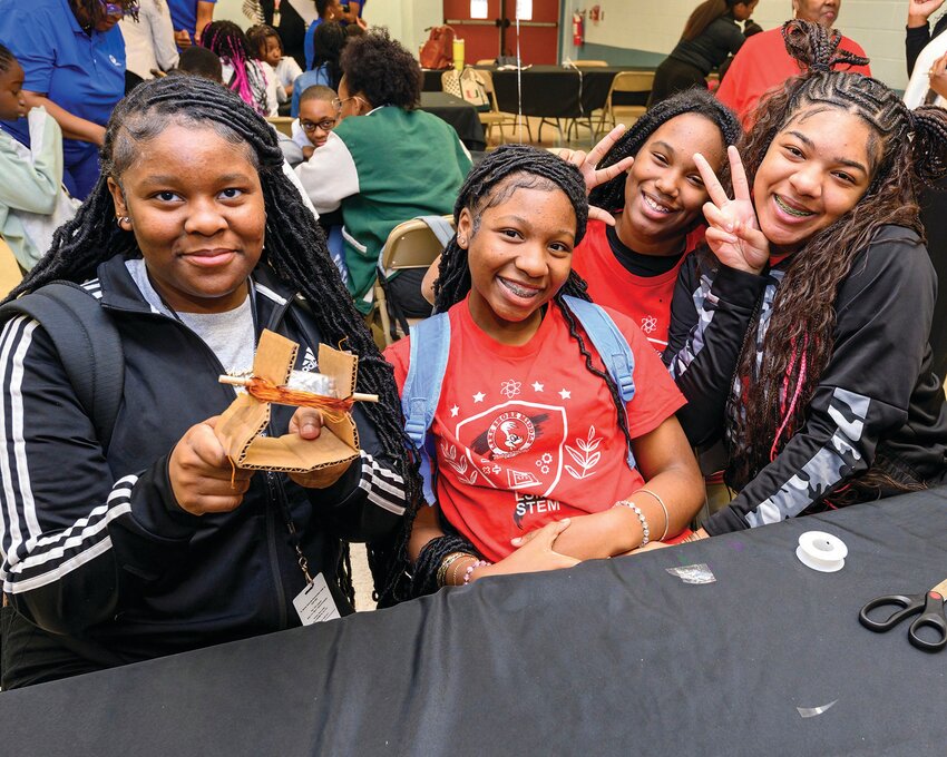 Students from Lake Shore Middle school pose with their hand-made generator during their STEM Classroom Makeover reveal day with Florida Power & Light Company on Thursday, Feb. 15 in Belle Glade. [Photo by Doug Murray/FPL]