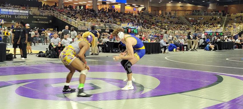 Gumaro Martinez III faces off against an opponent. [Photo courtesy CHS Wrestling]