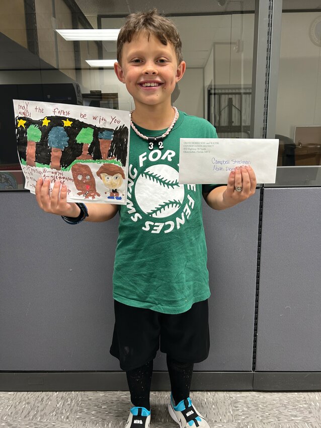 OKEECHOBEE -- Campbell Streelman won first place for Grades 2-3 in the Okeechobee Soil & Water Conservation District poster contest. [Photo courtesy OSWCD]