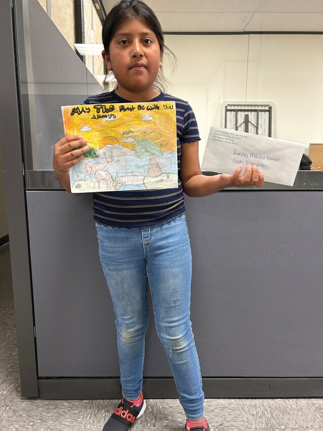 OKEECHOBEE -- Kendra Mendez Romero won first place for Grades 4-6 in the Okeechobee Soil & Water Conservation District poster contest. [Photo courtesy OSWCD]