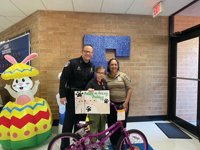 CLEWISTON -- Congratulations to Eastside Elementary School’s Polina Meshcheriakova on winning a new bike through the Clewiston Animal Services art competition.  Her amazing work of art was selected to bring awareness to the shelter and the need to spay and neuter our animals.  [Photo courtesy Eastside Elementary]
