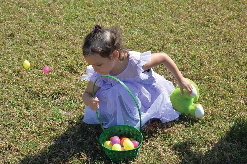 OKEECHOBEE -- Little ones enjoyed hunting Easter Eggs at the Spring Festival held March 31 at the Okeechobee County Agri-Civic Center. [Photo by Katrina Elsken/Lake Okeechobee News]