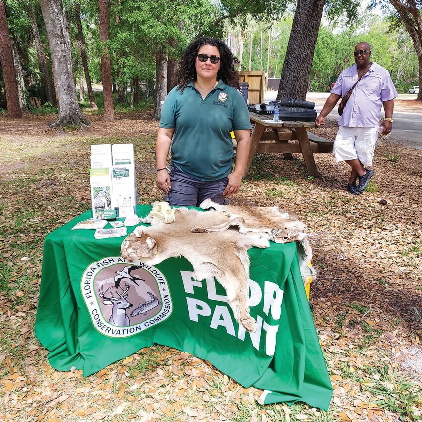 FWC Panther Biologist Carol Rizkalla with her display at the Earth Day Festival in April 2023.