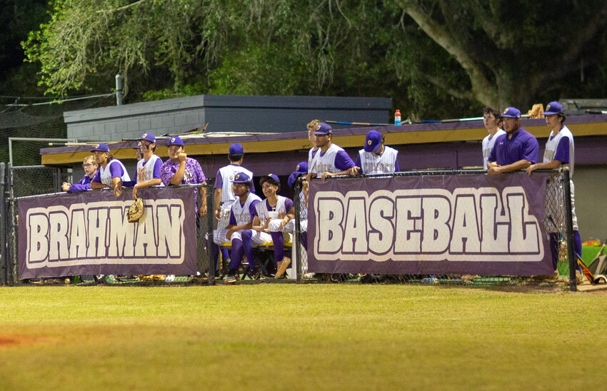 The Brahmans watch as their teammate fouls off a pitch against Clewiston. [Photo by Richard Marion/Lake Okeechobee News]